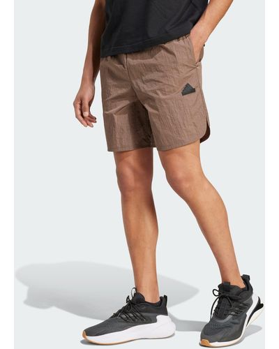 adidas Funktionsshorts CITY ESCAPE WOVEN SHORTS - Braun
