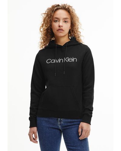 Calvin Klein Kapuzensweatshirt LOGO ELASTIC HOODIE mit Logoschriftzug in  Weiß | Lyst DE