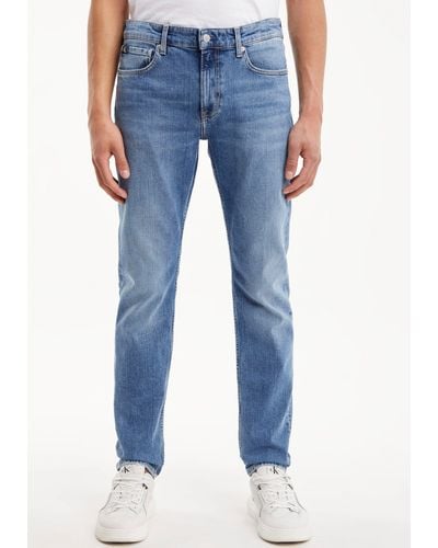 Calvin Klein Tapered-fit-Jeans SLIM TAPER mit Calvin Klein Leder-Badge - Blau