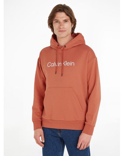 Calvin Klein Kapuzensweatshirt HERO LOGO COMFORT HOODIE mit Logoschriftzug - Orange