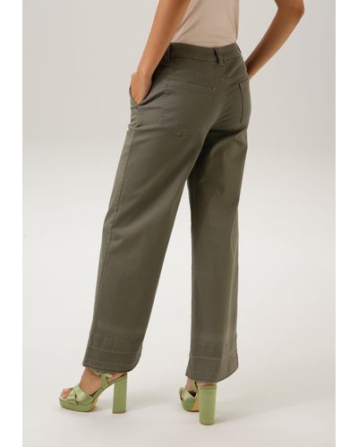 Aniston CASUAL Straight-Jeans mit trendiger Waschung am ausgefranstem Beinabschluss- NEUE KOLLEKTION - Braun