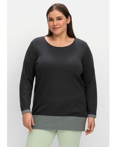 Sheego Sweatshirt Große Größen in Longform mit breitem Saum - Schwarz