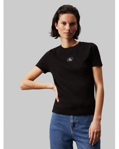 Calvin Klein T-Shirt WOVEN LABEL RIB BABY TEE mit Logopatch - Schwarz