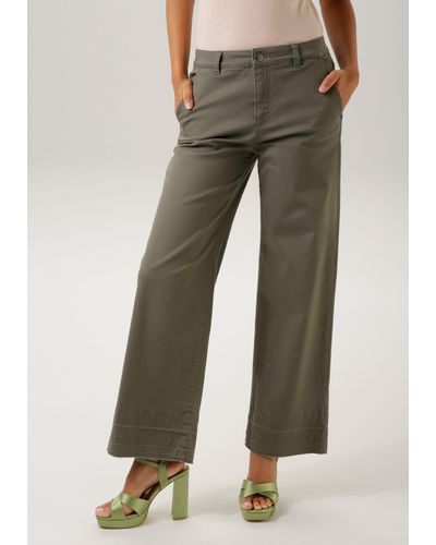 Aniston CASUAL Straight-Jeans mit trendiger Waschung am ausgefranstem Beinabschluss- NEUE KOLLEKTION - Braun