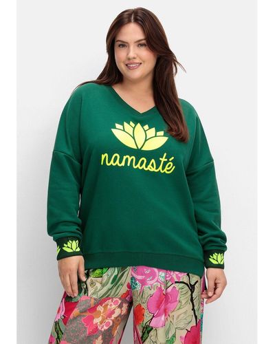 Sheego Sweatshirt Große Größen mit Yogaprint vorn und an den Bündchen - Grün
