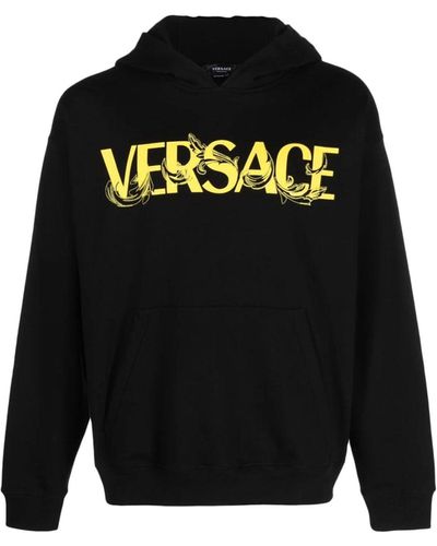 Black sweatshirt online with gold writing
