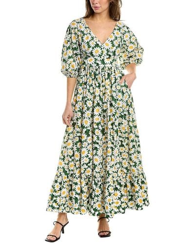 Green Floral Dress: a plus size summer outfit featuring a green floral dress  and wide fit straw hat from Torrid, and a dark green Kate Spade handbag.