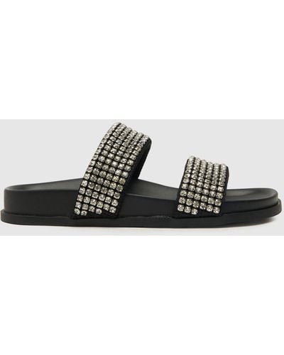 Schuh Tessie Embellished Mule Sandals In - Black