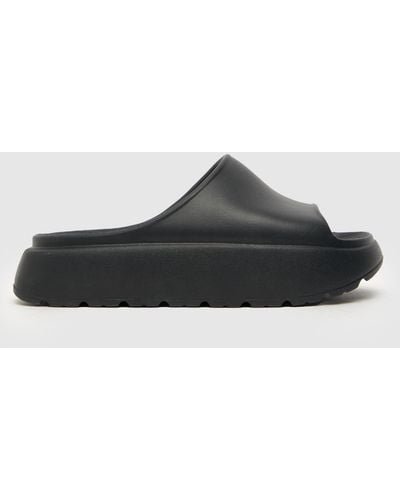 Schuh Tatia Footbed Slider Sandals In - Black