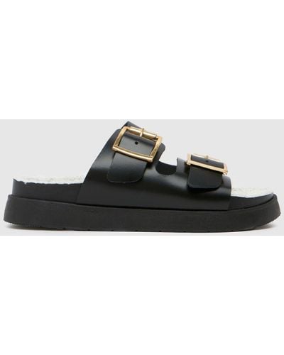 Schuh Truvy Sock Buckle Sandals In - Black