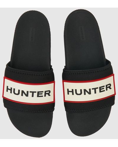 HUNTER Logo Slider Sandals In - Black