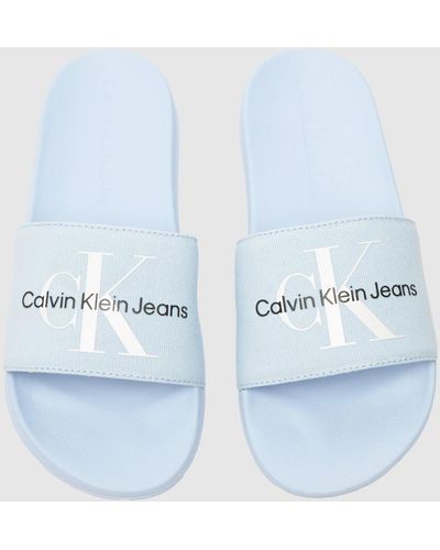 Ck Jeans Slide Monogram Sandals In - Blue