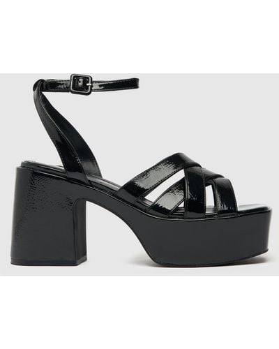 Schuh Sloane Strappy Platform High Heels In - Black