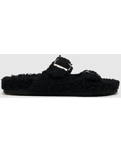 Schuh Haven Borg Buckle Slippers In - Black