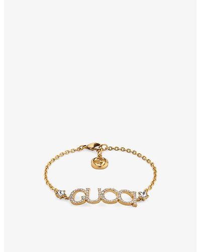 Gucci Logo-script Embellished Antique Gold-toned Metal Bracelet - Metallic