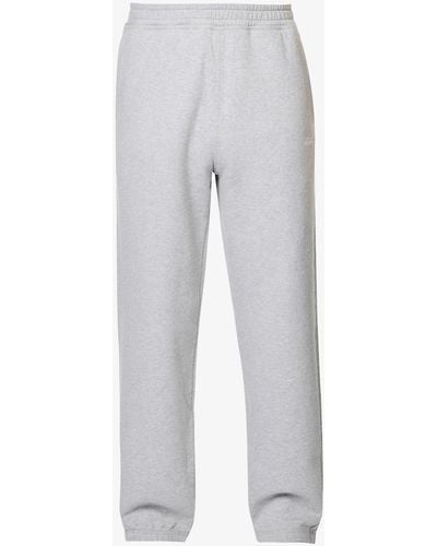 Stussy Stock Logo-embroidered Tapered-leg Cotton jogging Bottoms - White