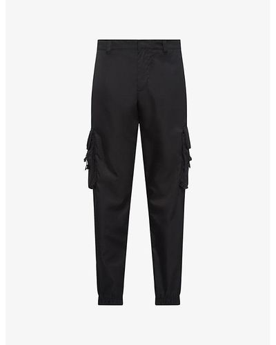 Prada Re-nylon Buckle-embellished Tapered Slim-fit Recycled-nylon Trousers - Black