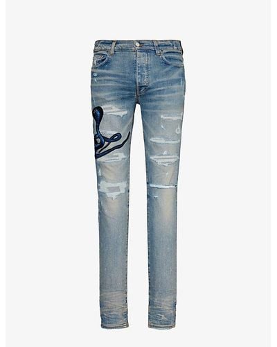 Amiri Snake-patch Slim-fit Tapered Stretch-denim Jeans - Blue