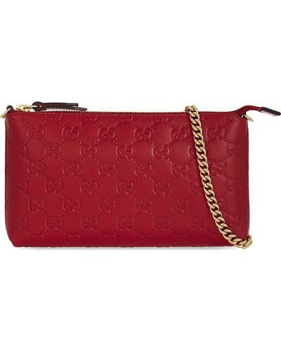 Gucci GG Signature Embossed Leather Clutch - Red