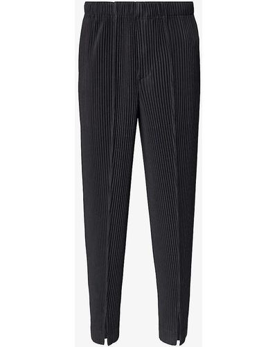 Homme Plissé Issey Miyake Pleated Tapered-leg Regular-fit Knitted Trousers - Blue