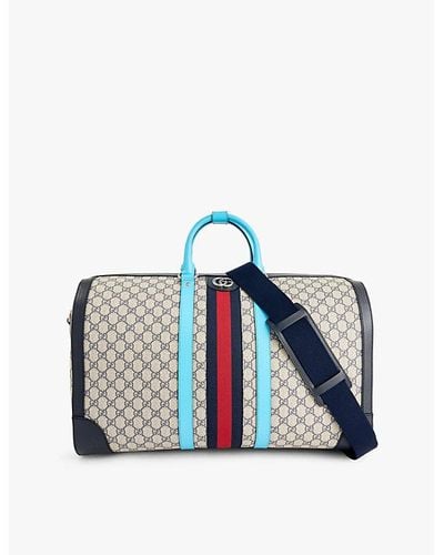 Gucci Monogram-print Web-stripe Coated-canvas Duffle Bag - Blue