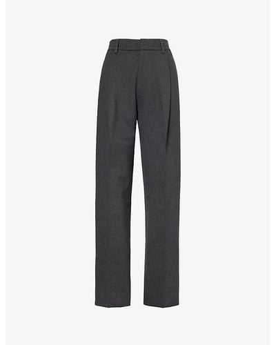 Victoria Beckham Pleated Tapered-leg Mid-rise Stretch-woven Pants - Black