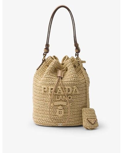 Prada Logo-embroidered Raffia Bucket Bag - Metallic