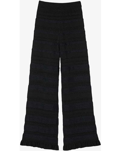 Sandro Ruffle-trim Flared-leg Stretch-knit Trousers - Black