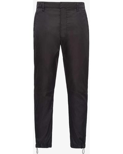 Prada Brand-plaque Drawstring-hem Skinny-fit Slim-leg Re-nylon Trousers - Black
