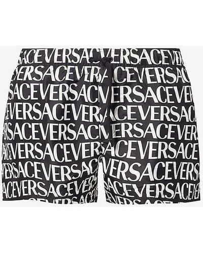 Versace Brand-print Slip-pocket Swim Short - Black