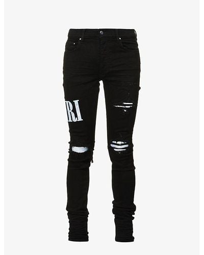 Amiri Tie-dye Underlay Distressed Skinny Stretch-denim Jeans - Black