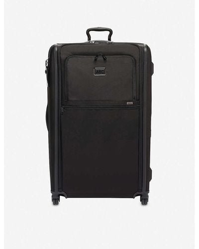 Tumi Black Worldwide Trip Expandable 4-wheeled Suitcase
