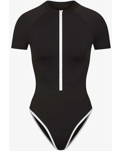 Skims Sporty High-neck Stretch-recycled Nylon Swimsuit - Black