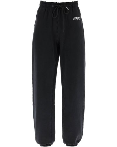 Versace Distressed jogger Pants With Logo Embroidery - Black