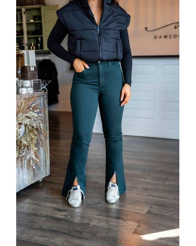https://cdna.lystit.com/400/500/tr/photos/shoppremiumoutlets/77840546/just-black-denim-gold-High-Rise-Front-Slit-Flare-Jeans-In-Emerald.jpeg