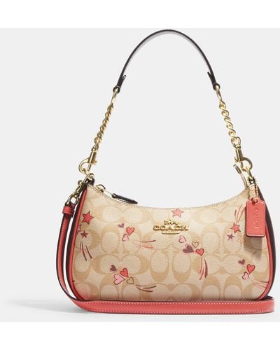 COACH Teri Shoulder Bag In Signature Canvas With Heart And Star Print - Pink