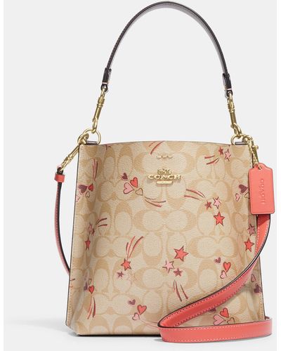 COACH Mollie Bucket Bag 22 In Signature Canvas With Heart And Star Print - Pink