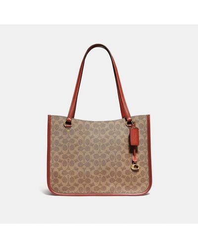 COACH Tyler Carryall In Signature Canvas - Brown