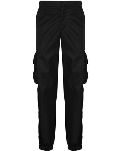 Prada Re-nylon Buckle-embellished Tapered Slim-fit Recycled-nylon Trousers - Black