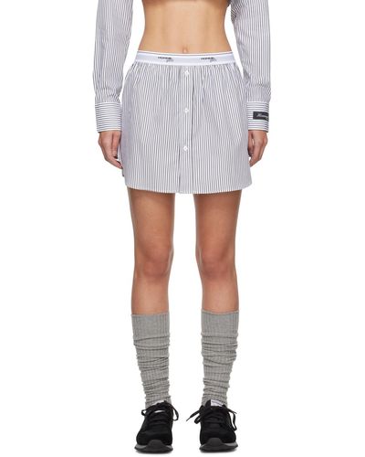 HOMMEGIRLS Mini-jupe blanche à ourlet pan de chemise - Noir