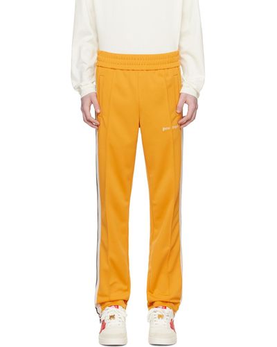 Palm Angels Pantalon de survêtement jaune à rayures