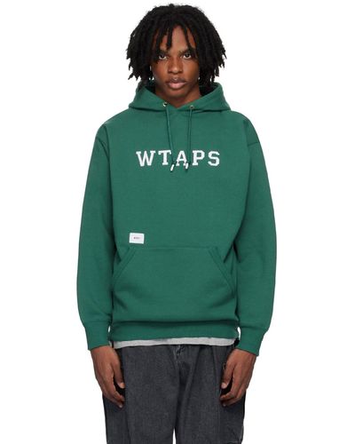 WTAPS Pull à capuche vert à appliqués à logo de style collégial