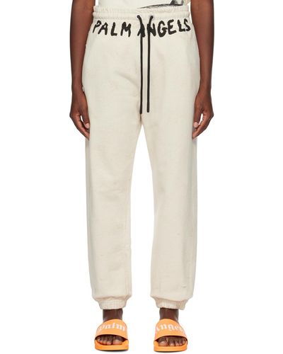 Palm Angels Pantalon de survêtement blanc cassé à effet délavé - Neutre