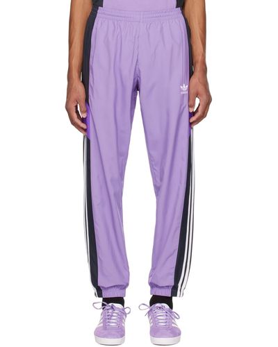 adidas Originals Pantalon de survêtement rekive mauve et noir - Violet