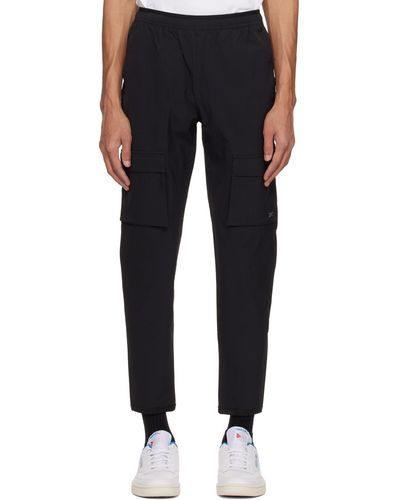 Reebok Pantalon cargo noir à logo contrecollé - Bleu