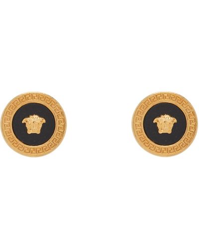 Versace Clous d'oreilles dorés à méduse et à ornement noir en émail