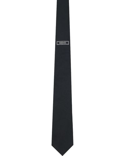 Versace Cravate noire à logo rétro '90s
