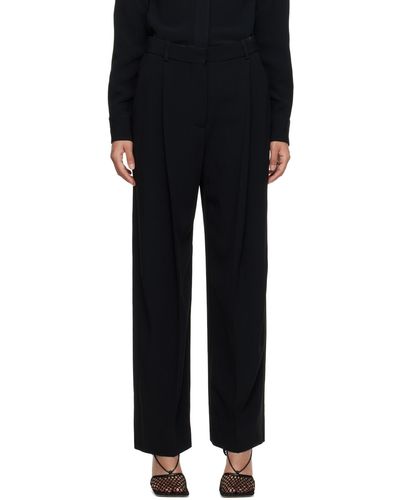 Victoria Beckham Pantalon ample noir à plis