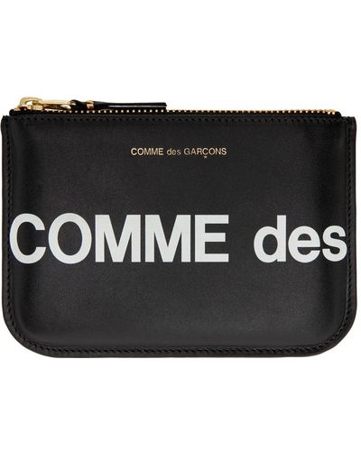 Comme des Garçons Comme des garçons wallets pochette noire en cuir à grand logo