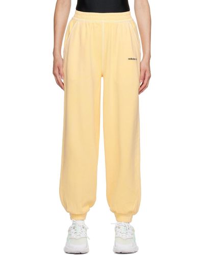 adidas Originals Pantalon de détente jaune à logo imprimé - Neutre